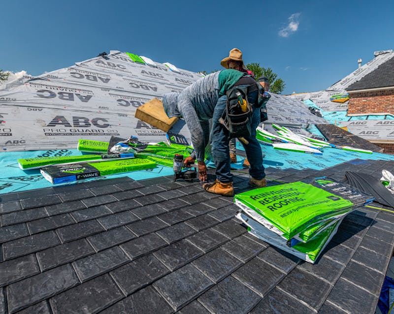 roofers working under the hot sun